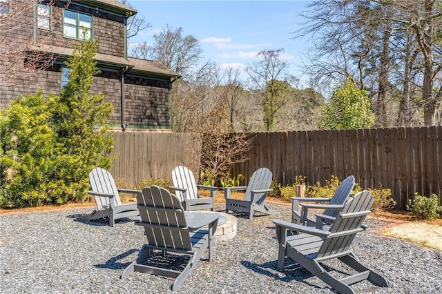 view of yard with a patio, an outdoor fire pit, and fence