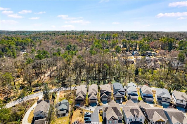 aerial view with a residential view and a wooded view