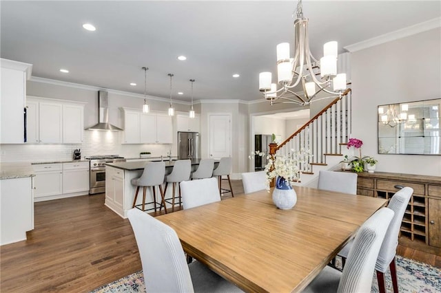 dining room featuring stairway, dark wood finished floors, an inviting chandelier, recessed lighting, and crown molding