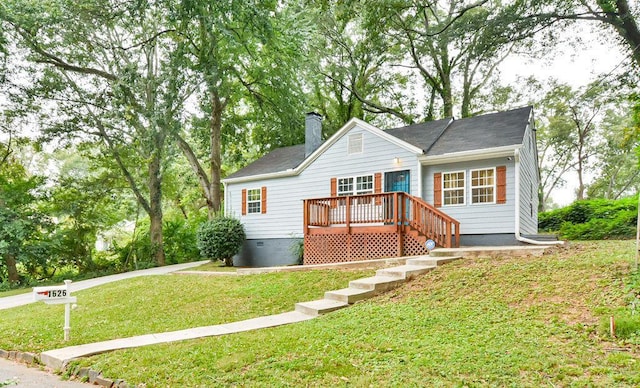 view of front of house featuring a chimney, a front yard, and crawl space