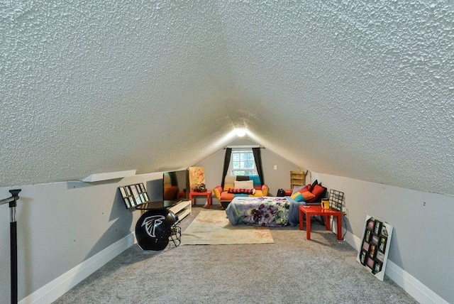 carpeted bedroom featuring a textured ceiling, vaulted ceiling, and baseboards