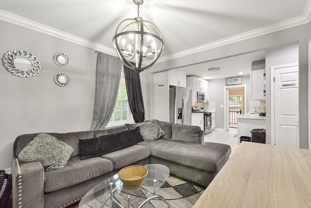 living area with a chandelier and ornamental molding
