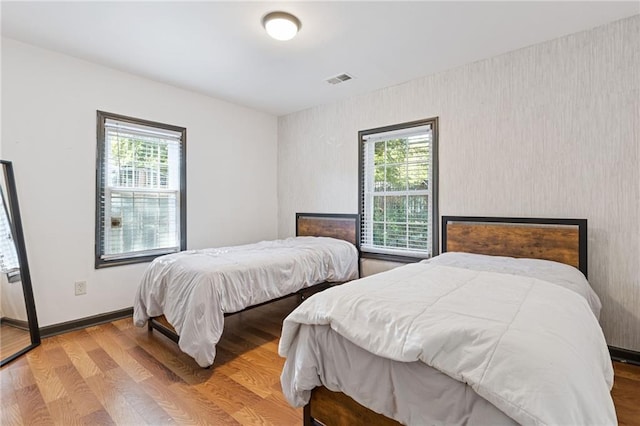 bedroom with wood-type flooring