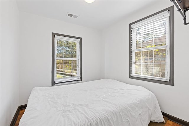 bedroom featuring dark wood-type flooring