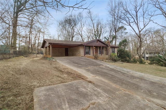 ranch-style house with a carport