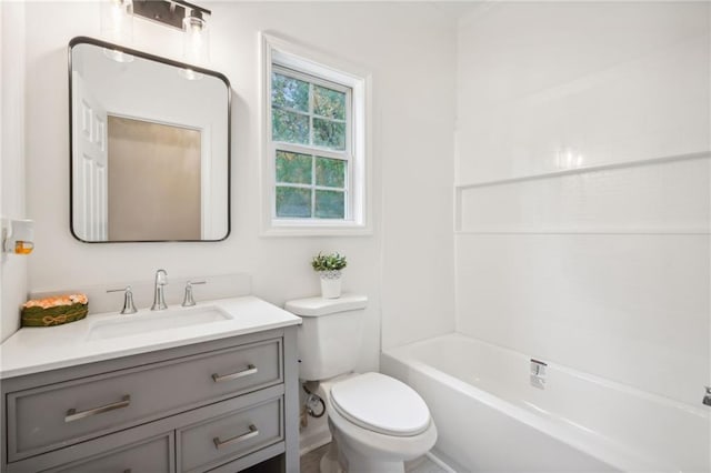 full bathroom featuring vanity, toilet, and washtub / shower combination