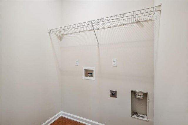 laundry area with hookup for an electric dryer, hookup for a washing machine, and wood-type flooring