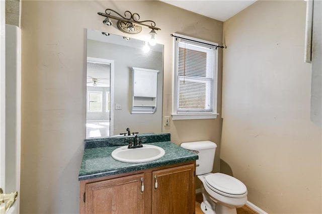 bathroom with vanity and toilet