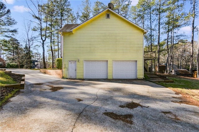 view of side of home with a garage