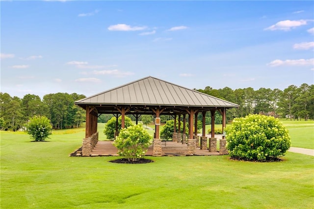 surrounding community with a gazebo and a lawn