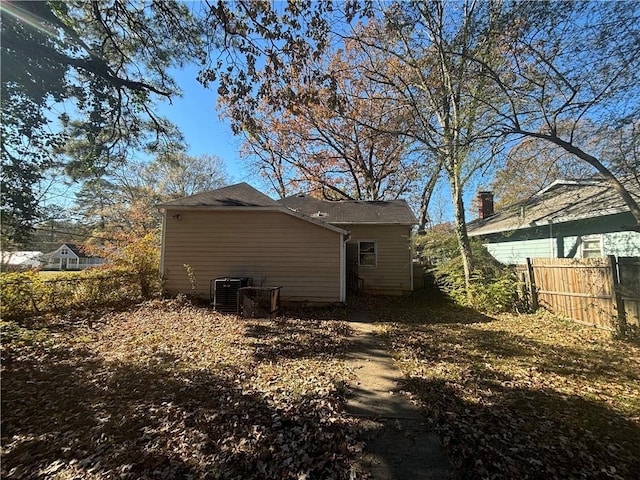 back of house with cooling unit