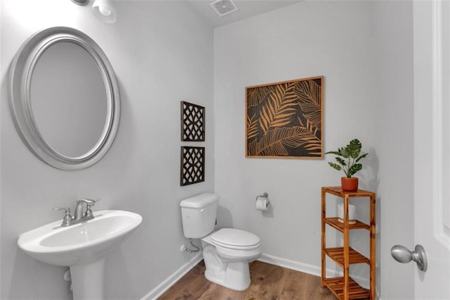 1311 Park Center Cir, Austell, GA 30168 - bathroom with wood finished floors and toilet