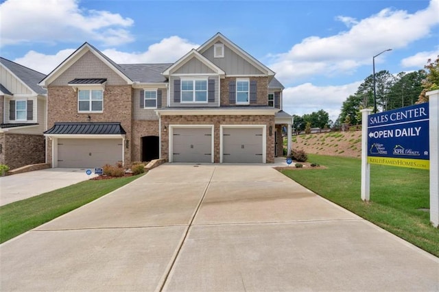 1311 Park Center Cir, Austell, GA 30168 - view of front of property featuring a garage, driveway, a front yard, board and batten siding, and brick siding