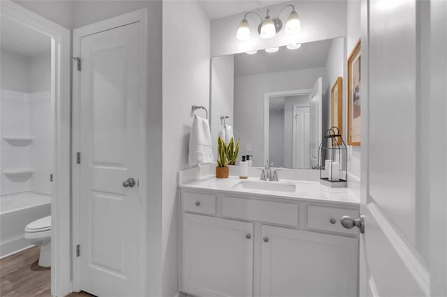 1311 Park Center Cir, Austell, GA 30168 - bathroom with vanity, wood finished floors, and tub / shower combination