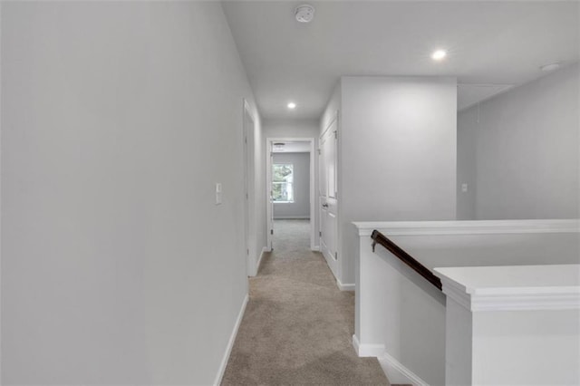 1311 Park Center Cir, Austell, GA 30168 - hallway featuring an upstairs landing, light colored carpet, and recessed lighting