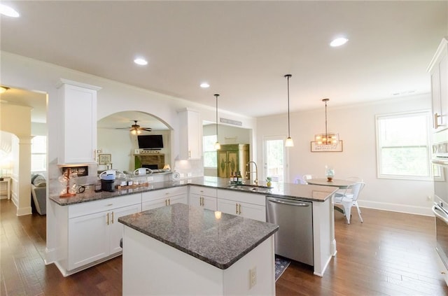 6828 New Fern Ln, Flowery Branch, GA 30542 - kitchen featuring stainless steel appliances, a peninsula, a ceiling fan, white cabinetry, and dark wood-style floors