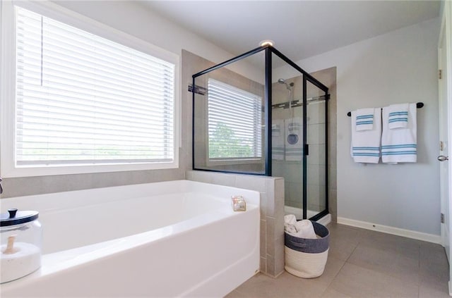 6828 New Fern Ln, Flowery Branch, GA 30542 - bathroom with a garden tub, a stall shower, and tile patterned floors