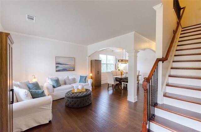 6828 New Fern Ln, Flowery Branch, GA 30542 - living area featuring arched walkways, ornate columns, crown molding, wood finished floors, and stairs