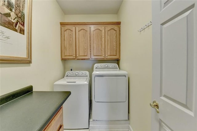 laundry area with cabinet space and washer and clothes dryer