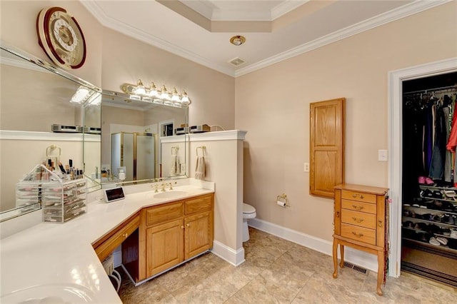 full bath featuring toilet, a shower stall, ornamental molding, and vanity