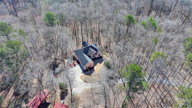 aerial view featuring a wooded view