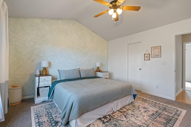 carpeted bedroom featuring ceiling fan, baseboards, and vaulted ceiling