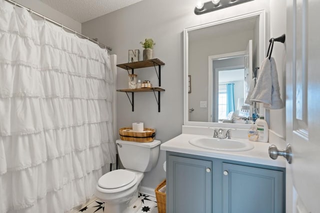 full bathroom featuring a shower with shower curtain, toilet, a textured ceiling, vanity, and tile patterned floors