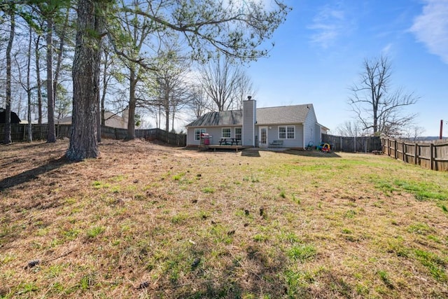 view of yard featuring a fenced backyard and a wooden deck