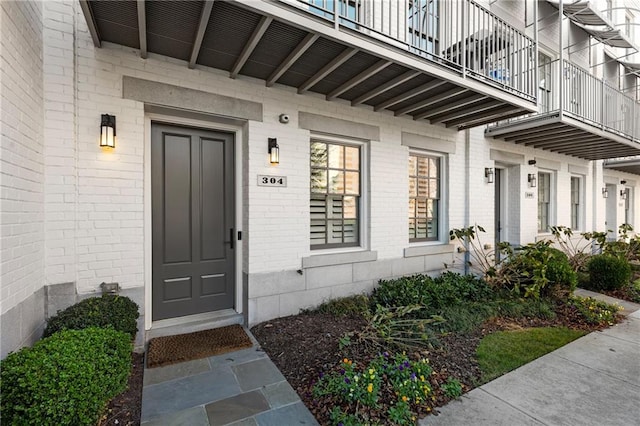 entrance to property with a balcony