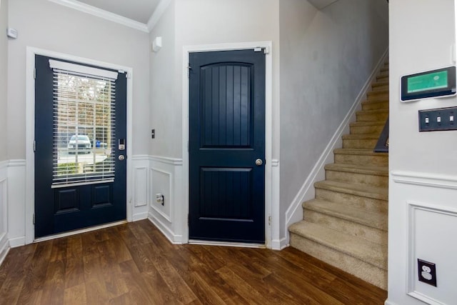 foyer featuring dark hardwood / wood-style flooring and ornamental molding