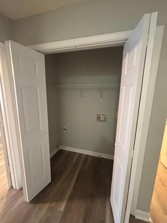 laundry area featuring hookup for a washing machine and dark hardwood / wood-style flooring