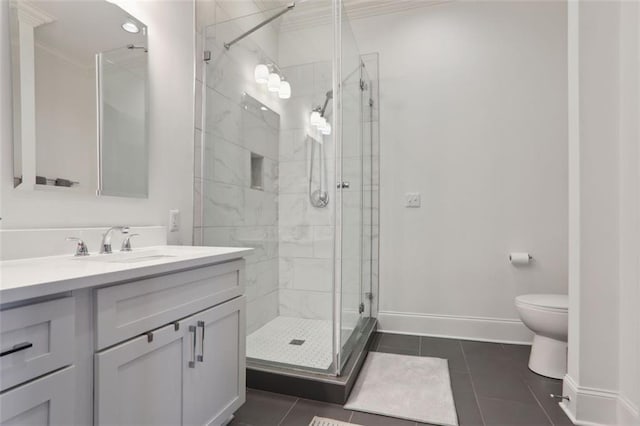 bathroom with a stall shower, baseboards, toilet, tile patterned floors, and vanity