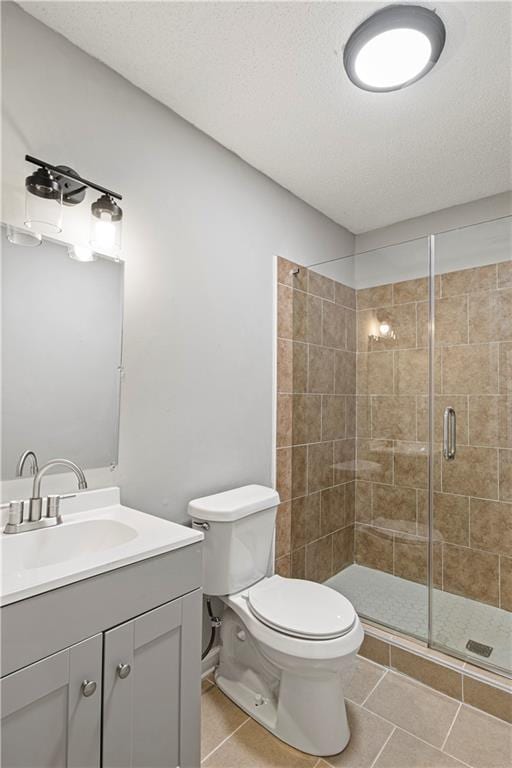 2309 Carver Dr NW, Atlanta, GA 30314 - bathroom featuring a stall shower, toilet, tile patterned flooring, and vanity