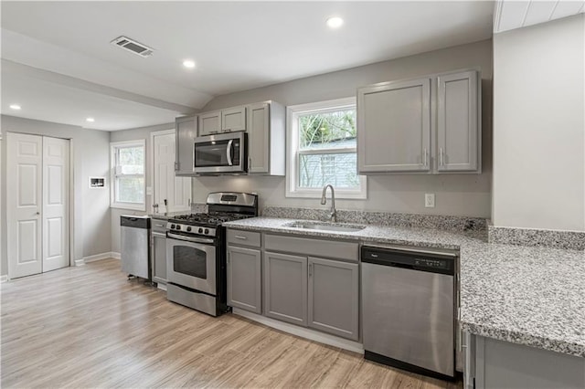 2309 Carver Dr NW, Atlanta, GA 30314 - kitchen with stainless steel appliances, a sink, gray cabinets, and recessed lighting