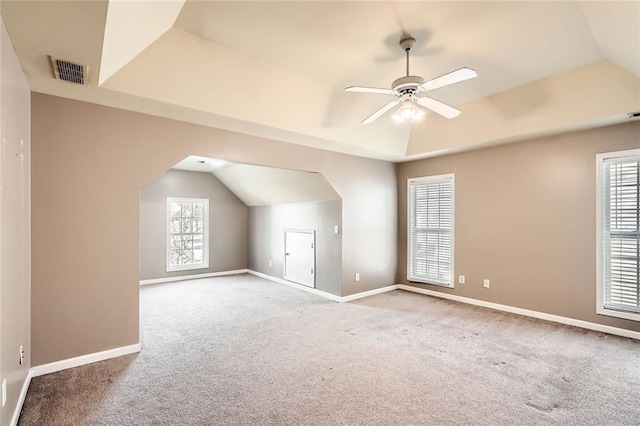 additional living space with carpet floors, vaulted ceiling, and ceiling fan