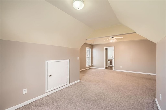 bonus room with carpet floors, ceiling fan, and lofted ceiling