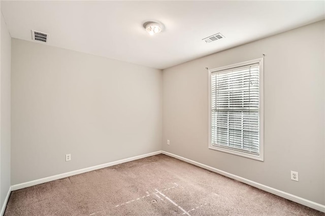 spare room featuring carpet flooring