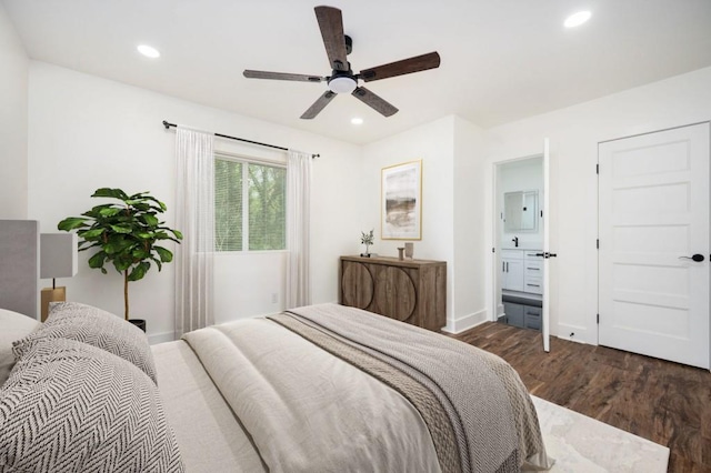 bedroom featuring connected bathroom, wood finished floors, a ceiling fan, baseboards, and recessed lighting