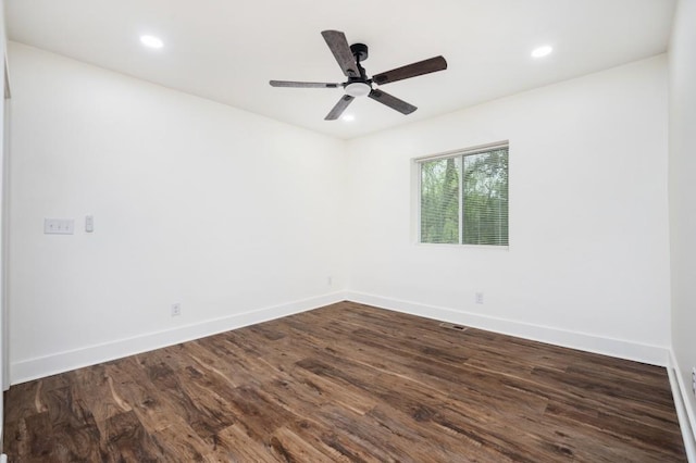 spare room featuring recessed lighting, baseboards, a ceiling fan, and dark wood finished floors