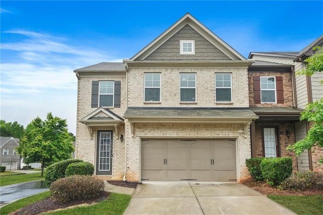 view of front of property featuring brick siding, an attached garage, and driveway