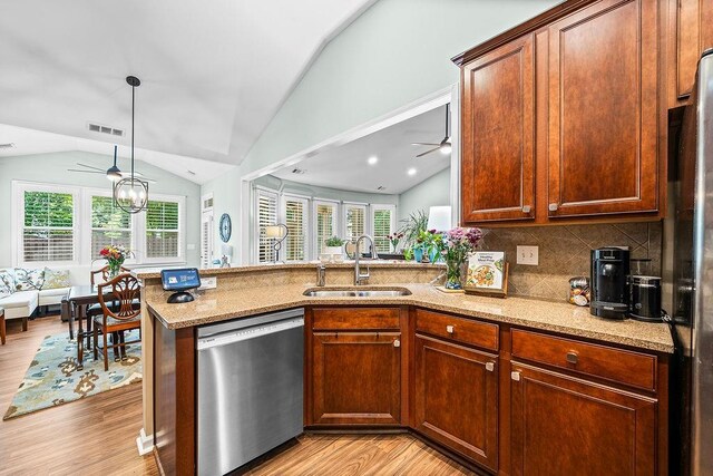 7731 Sleepy Lagoon Way, Flowery Branch, GA 30542 - kitchen with stainless steel dishwasher, ceiling fan, lofted ceiling, plenty of natural light, and light wood-style floors
