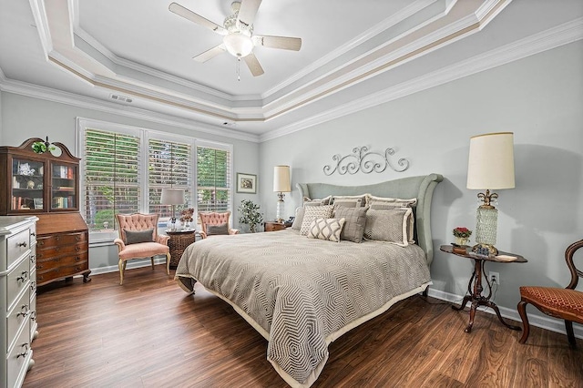 7731 Sleepy Lagoon Way, Flowery Branch, GA 30542 - bedroom featuring a tray ceiling, dark wood-style floors, crown molding, and a ceiling fan