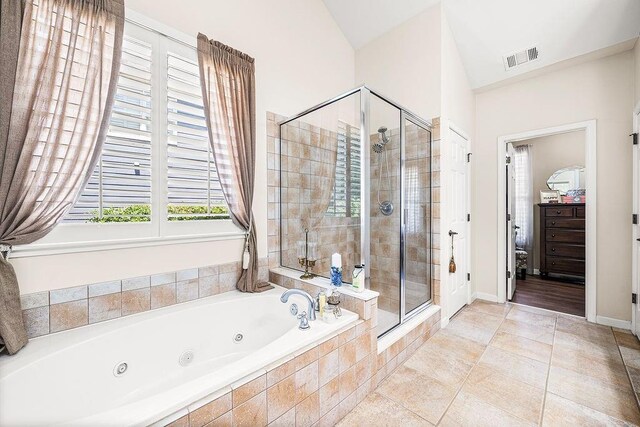 7731 Sleepy Lagoon Way, Flowery Branch, GA 30542 - full bathroom featuring a stall shower, a jetted tub, and tile patterned floors