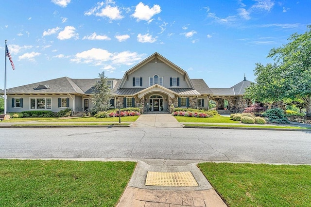 7731 Sleepy Lagoon Way, Flowery Branch, GA 30542 - view of front of property featuring a gambrel roof, stone siding, and a front yard