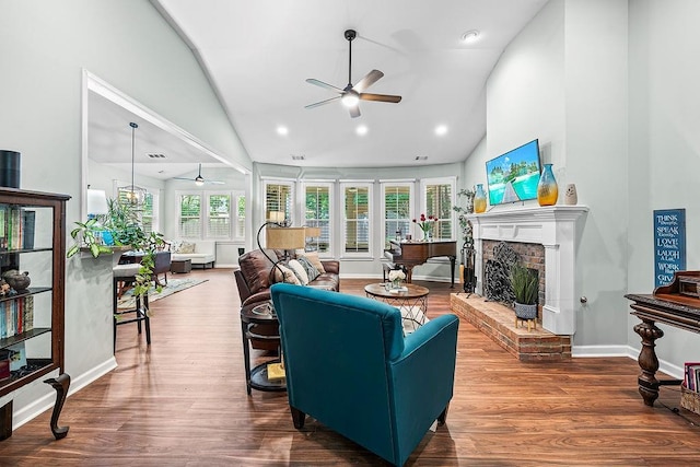 7731 Sleepy Lagoon Way, Flowery Branch, GA 30542 - living room with a ceiling fan, a fireplace, high vaulted ceiling, wood finished floors, and recessed lighting