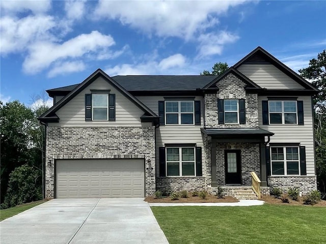 view of front of home featuring a garage and a front lawn