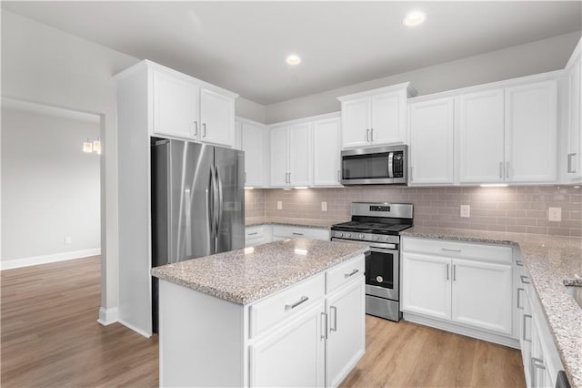 4238 Linworth Blvd, Austell, GA 30106 - kitchen featuring appliances with stainless steel finishes, light wood-style flooring, white cabinets, and recessed lighting
