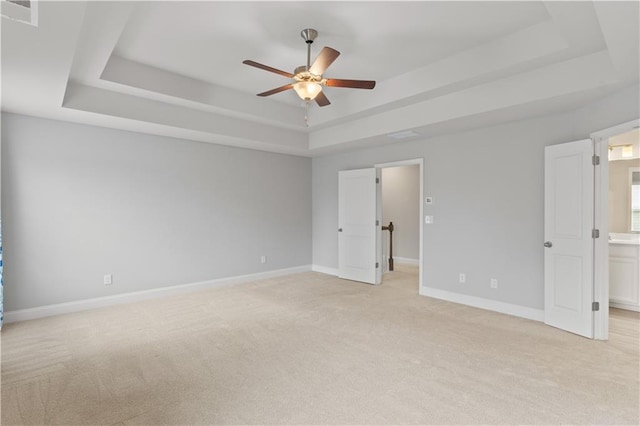 4238 Linworth Blvd, Austell, GA 30106 - unfurnished bedroom featuring a tray ceiling, light colored carpet, baseboards, and ceiling fan