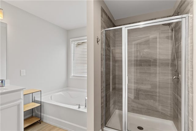 4238 Linworth Blvd, Austell, GA 30106 - bathroom with vanity, a stall shower, a bath, and wood finished floors
