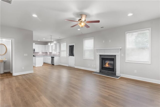 4238 Linworth Blvd, Austell, GA 30106 - unfurnished living room with a ceiling fan, recessed lighting, baseboards, and wood finished floors